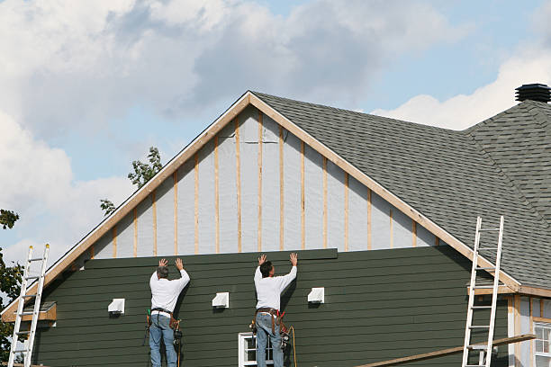 Professional Siding technician working in Florence, OR